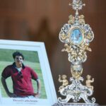 The reliquary containing remains of Blessed Carlo Acutis, and his photo. The Italian teen had a great love of the Eucharist and used his technology skills to build an online database of eucharistic miracles around the world.