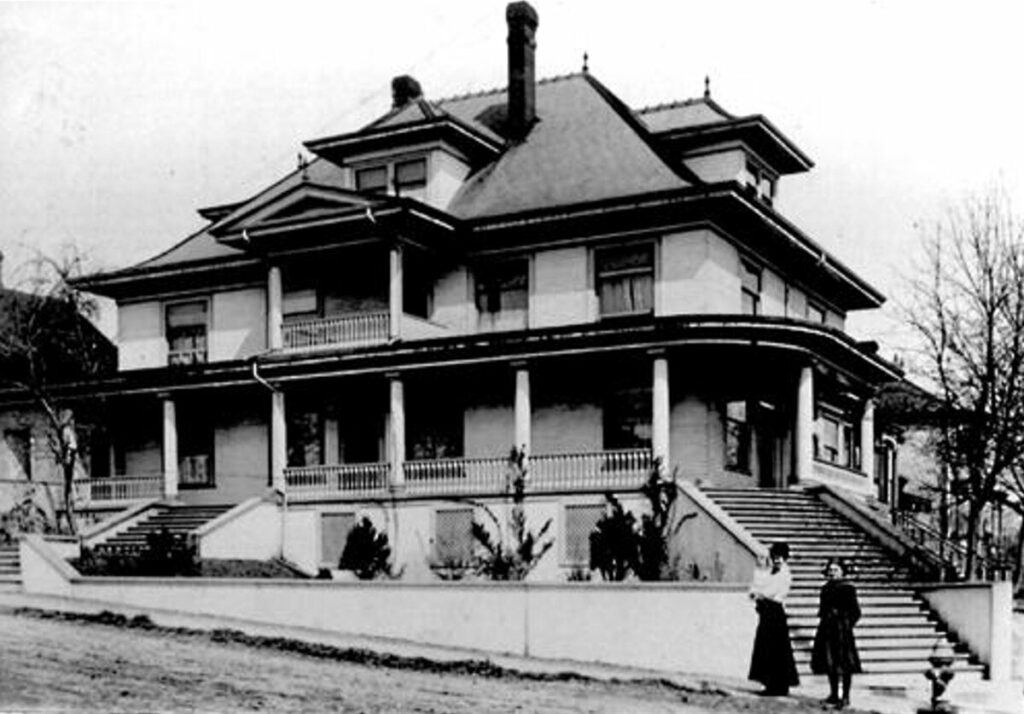 The Bilodeau home at 219 Carnarvon St., with Ellen Bilodeau and children. (Steve Norman Collection)