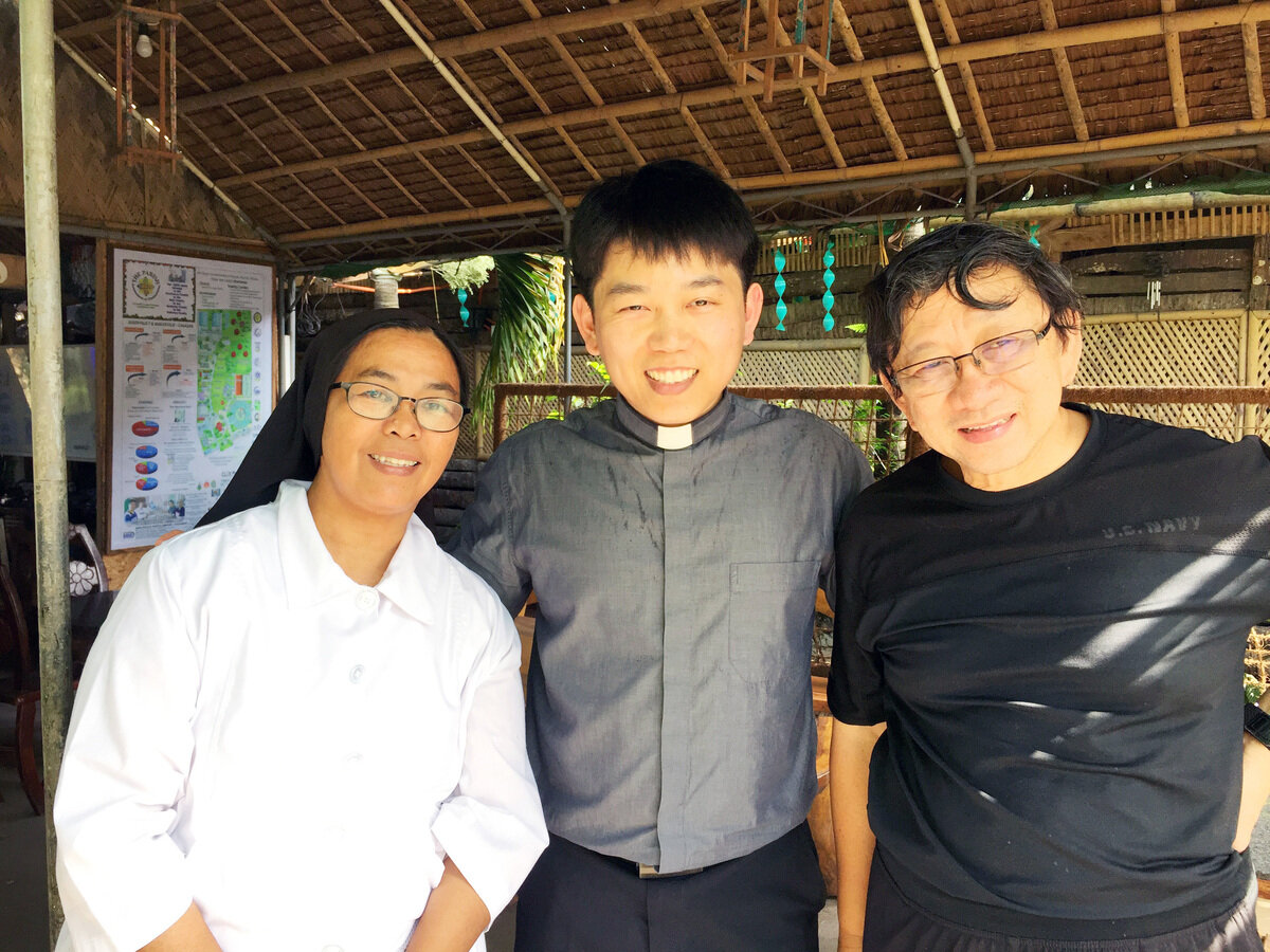 Father Paul Goo, centre, is pictured during a missions trip to the Philippines in 2017, will serve in the Vatican's Secretariat of State beginning in January. Father Goo is pastor of Christ the Redeemer Parish in West Vancouver. (B.C. Catholic file photo)