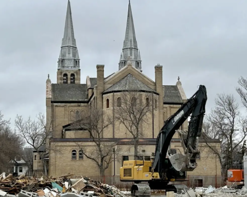 Construction underway at Holy Rosary Cathedral in Regina, Saskatchewan. New spires will be constructed in the cathedral’s parking lot, complete with structural steel, scaffolding, and metalwork, before being lifted back into place later next fall.