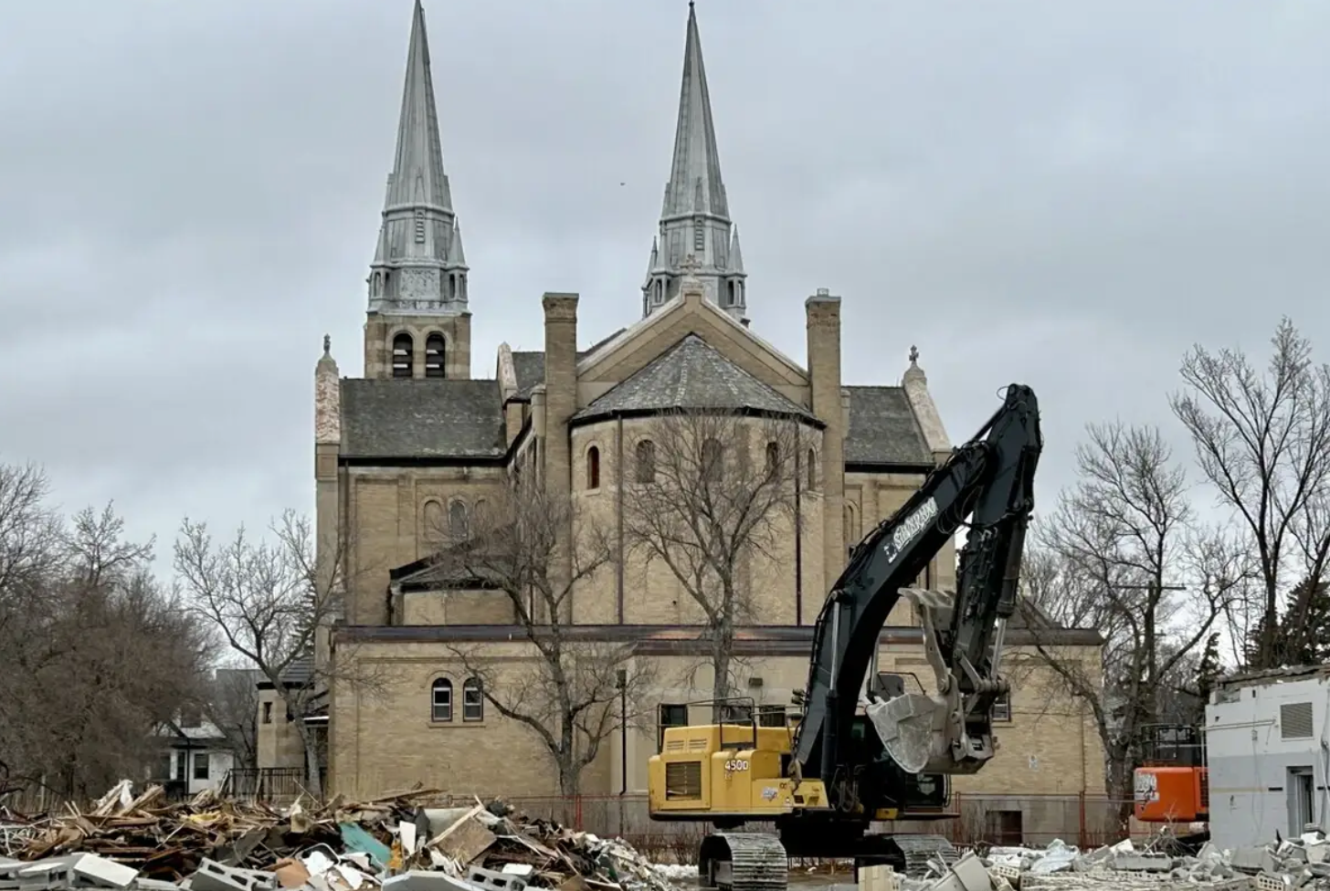 Construction underway at Holy Rosary Cathedral in Regina, Saskatchewan. New spires will be constructed in the cathedral’s parking lot, complete with structural steel, scaffolding, and metalwork, before being lifted back into place later next fall.